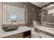 Contemporary bathroom featuring a sleek vanity, glass shower, and modern fixtures at 2293 Buckingham Ct, Henderson, NV 89074