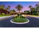 A guard-gated entrance welcomes you with its manicured landscaping and palm tree lined drive at 2293 Buckingham Ct, Henderson, NV 89074