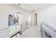 Second floor hallway with modern railing and a window overlooking the backyard at 2293 Buckingham Ct, Henderson, NV 89074