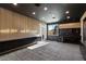 Spacious living room with custom cabinetry and a door leading to the backyard at 2293 Buckingham Ct, Henderson, NV 89074