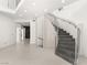 Modern staircase with a decorative partition on the side at 2293 Buckingham Ct, Henderson, NV 89074