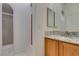 Bathroom featuring tile shower, tile floors, and granite countertop at 230 Pintale Cir, Henderson, NV 89074