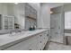 Modern bathroom showcasing double sinks, a walk-in shower, and elegant tile work at 230 Pintale Cir, Henderson, NV 89074