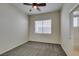 Neutral bedroom with large window and ceiling fan at 230 Pintale Cir, Henderson, NV 89074