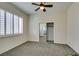 Neutral bedroom with large window and ceiling fan at 230 Pintale Cir, Henderson, NV 89074