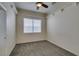 Neutral bedroom with large window and ceiling fan at 230 Pintale Cir, Henderson, NV 89074