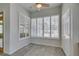 Breakfast nook boasts lots of natural light, tile floors, and shuttered windows with a view at 230 Pintale Cir, Henderson, NV 89074