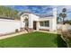 Close-up of a cozy single-story home with red tile roof, a small yard, and decorative stone accents at 230 Pintale Cir, Henderson, NV 89074