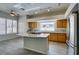 Bright kitchen with stainless steel appliances, granite countertops, and a large island with cooktop at 230 Pintale Cir, Henderson, NV 89074