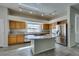 Kitchen showcasing granite countertops, stainless steel appliances, and a large island with a gas cooktop at 230 Pintale Cir, Henderson, NV 89074