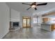 Spacious living room features a fireplace, tile floors, and access to the kitchen area at 230 Pintale Cir, Henderson, NV 89074