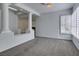 Bright living room showcasing a neutral carpet, shutters, and decorative pillars at 230 Pintale Cir, Henderson, NV 89074