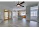 Open living space with tile flooring, fireplace, and natural light flowing into the kitchen at 230 Pintale Cir, Henderson, NV 89074