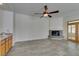 Bright living room features a fireplace, tile floors, and access to the outdoor patio at 230 Pintale Cir, Henderson, NV 89074