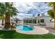 Backyard pool and spa with patio and sunroom in a beautifully landscaped yard at 230 Pintale Cir, Henderson, NV 89074