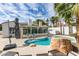 Backyard pool and spa with rock feature surrounded by patio and sunroom at 230 Pintale Cir, Henderson, NV 89074