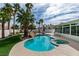 Beautiful backyard oasis with sparkling pool, spa, and tropical landscaping at 230 Pintale Cir, Henderson, NV 89074