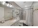 This bathroom features granite countertops, decorative shelves and a stylish shower at 2451 N Rainbow Blvd # 2076, Las Vegas, NV 89108