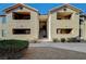 Exterior of the two-story residential building with desert landscaping and a walkway at 2451 N Rainbow Blvd # 2076, Las Vegas, NV 89108
