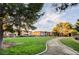 Well maintained condo complex with manicured lawn, trees, and walking path at 2451 N Rainbow Blvd # 2076, Las Vegas, NV 89108