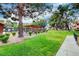 View of the verdant green space, walking path, pergola, and well-manicured bushes and trees at 2451 N Rainbow Blvd # 2076, Las Vegas, NV 89108