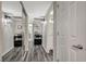 Hallway with mirrored closet doors and access to the bathroom at 2451 N Rainbow Blvd # 2076, Las Vegas, NV 89108