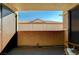 View of a private outdoor patio with tiled floor, textured walls, and exterior storage closet at 2451 N Rainbow Blvd # 2076, Las Vegas, NV 89108