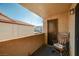 Private patio featuring storage closet, tile flooring, and a charming rocking chair with cushions at 2451 N Rainbow Blvd # 2076, Las Vegas, NV 89108