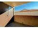 View of an outdoor patio with tile flooring, textured walls, and an exterior storage closet at 2451 N Rainbow Blvd # 2076, Las Vegas, NV 89108