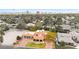 Expansive aerial view showcasing a house with a red tile roof in a neighborhood near the Las Vegas skyline at 2501 Wimbledon Dr, Las Vegas, NV 89107