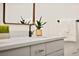 Modern bathroom vanity with matte black faucet, potted plant, and decorative hand towel at 2501 Wimbledon Dr, Las Vegas, NV 89107