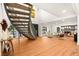 Grand foyer with a spiral staircase, hardwood floors, and abundant natural light streaming through large windows at 2501 Wimbledon Dr, Las Vegas, NV 89107