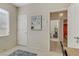 Bedroom featuring a bed, adjoining doorway and bright window, great for use as an office or guest bedroom at 2537 Nashira St, Henderson, NV 89044