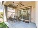 Charming outdoor patio featuring a ceiling fan and a sliding glass door entry into the home at 2537 Nashira St, Henderson, NV 89044