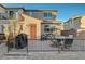 Cozy backyard patio with outdoor seating and a grill, perfect for entertaining and relaxing outdoors at 2657 Fawn Beige Ct, North Las Vegas, NV 89086