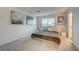 Comfortable bedroom with carpet, window, and modern decor and side tables at 2657 Fawn Beige Ct, North Las Vegas, NV 89086