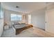 Inviting bedroom with soft carpet, neutral decor, and natural light from the window at 2657 Fawn Beige Ct, North Las Vegas, NV 89086