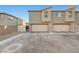 Exterior showing garages and driveway at 2657 Fawn Beige Ct, North Las Vegas, NV 89086