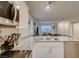 Bright kitchen with stainless appliances, granite counters, and an open layout to the living area at 2657 Fawn Beige Ct, North Las Vegas, NV 89086