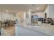 Stylish kitchen with granite countertops, stainless steel appliances, and a view of the dining area at 2657 Fawn Beige Ct, North Las Vegas, NV 89086