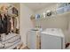 Laundry room with a washer and dryer and shelving at 2657 Fawn Beige Ct, North Las Vegas, NV 89086