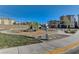 Community playground with climbing structure, slides, benches, and pet waste station at 2657 Fawn Beige Ct, North Las Vegas, NV 89086