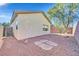 Low maintenance backyard featuring desert landscaping, gravel and flagstone accents and stucco walls at 2812 Dotted Wren Ave, North Las Vegas, NV 89084