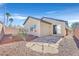 Low maintenance backyard with custom stone features and block wall offers privacy and desert landscaping at 2812 Dotted Wren Ave, North Las Vegas, NV 89084