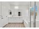 Bright bathroom featuring double sinks, a soaking tub and glass enclosed shower at 2812 Dotted Wren Ave, North Las Vegas, NV 89084