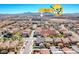 Aerial view of a residential area, school in the background, highlighting community and location at 3204 Romanesque Art Ave, Henderson, NV 89044