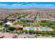 Expansive aerial view of a community pool and clubhouse amid well-maintained landscaping at 3204 Romanesque Art Ave, Henderson, NV 89044