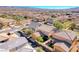 Stunning aerial view of a home showcasing its tile roof and well-manicured landscaping in a desirable neighborhood at 3204 Romanesque Art Ave, Henderson, NV 89044