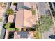 Birds eye view of a home showcasing its backyard, landscaping, and proximity to neighborhood streets and amenities at 3204 Romanesque Art Ave, Henderson, NV 89044