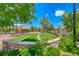 Beautiful community park featuring green space, mature trees, and seating areas for relaxation and enjoyment at 3204 Romanesque Art Ave, Henderson, NV 89044